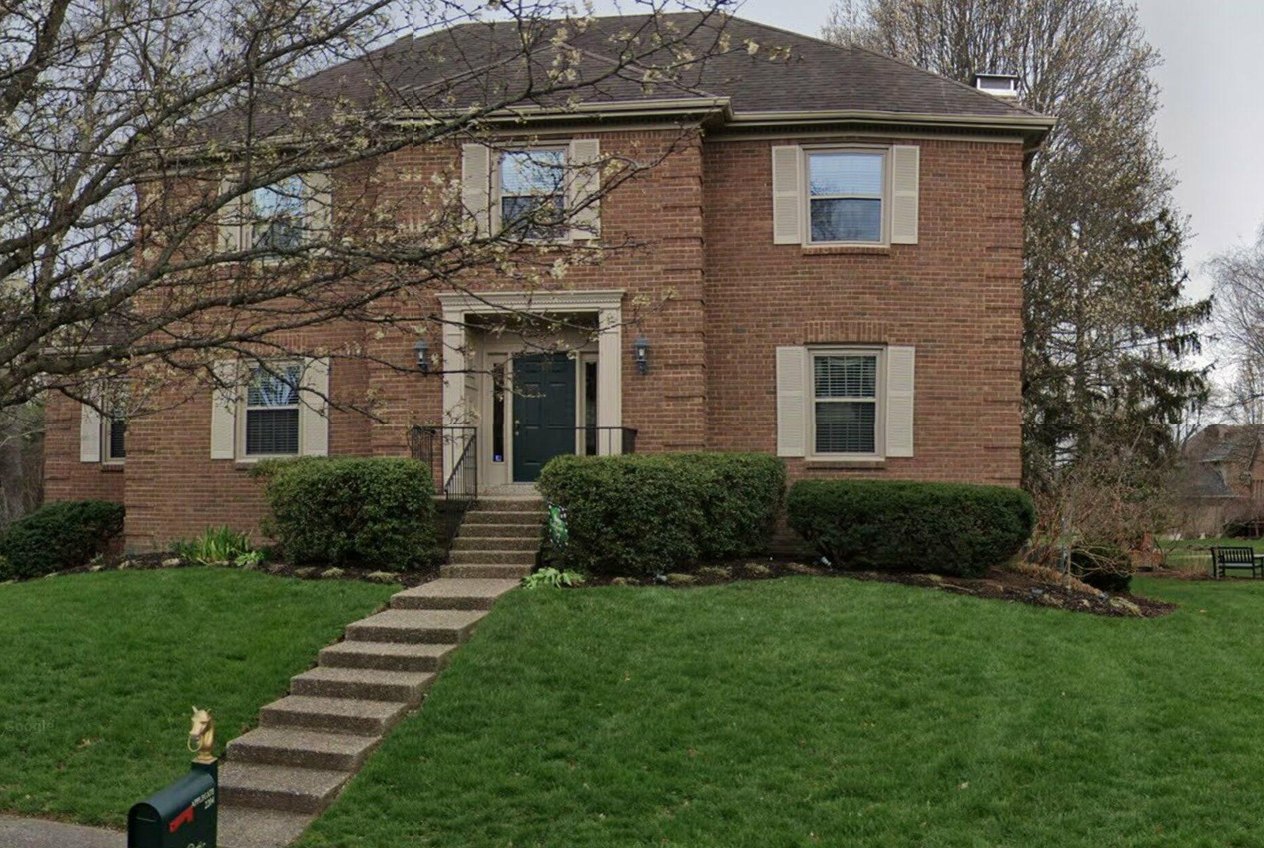 A two-story brick colonial on an ordinary afternoon